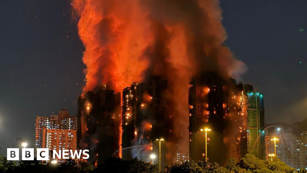 At least four dead as fire engulfs Hong Kong tower blocks