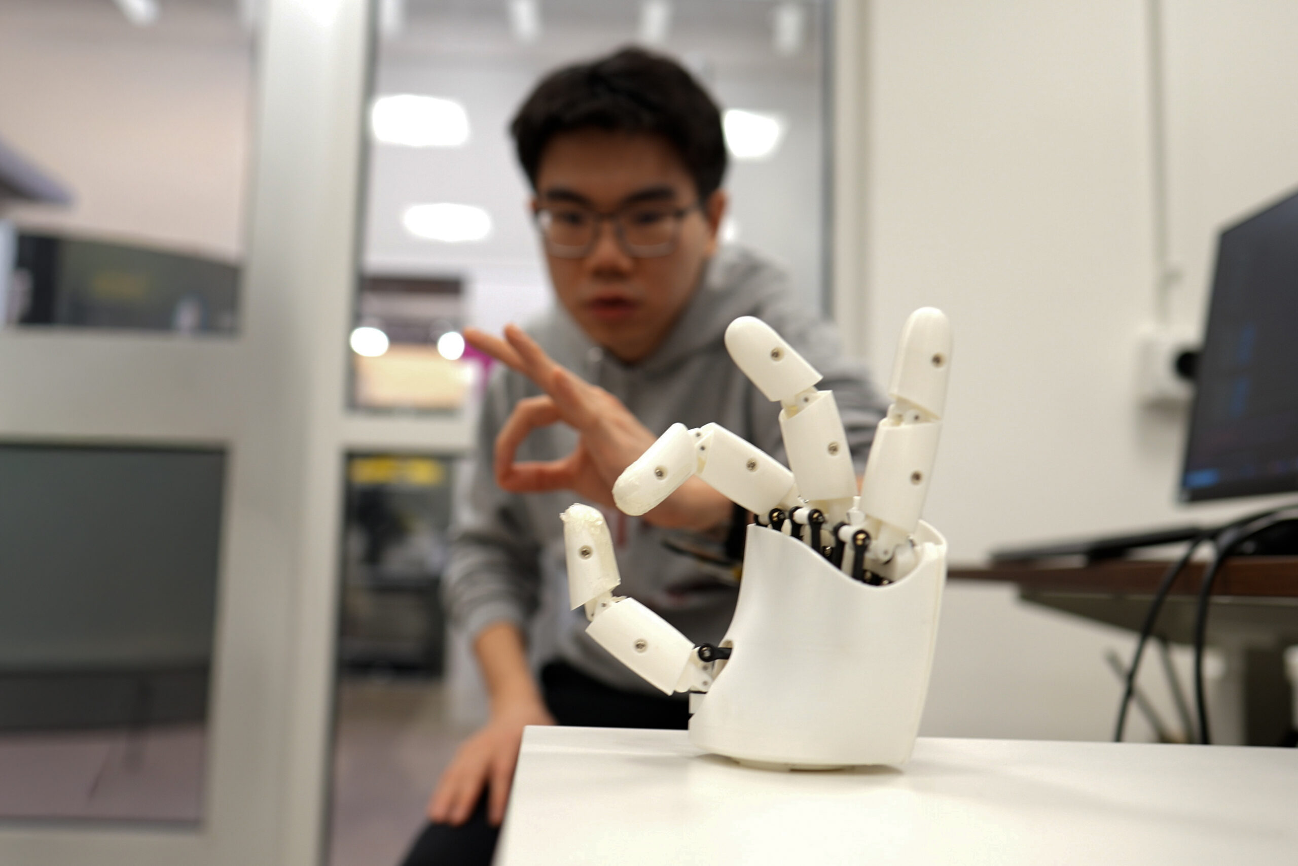 Wristband enables wearers to control a robotic hand with their own movements