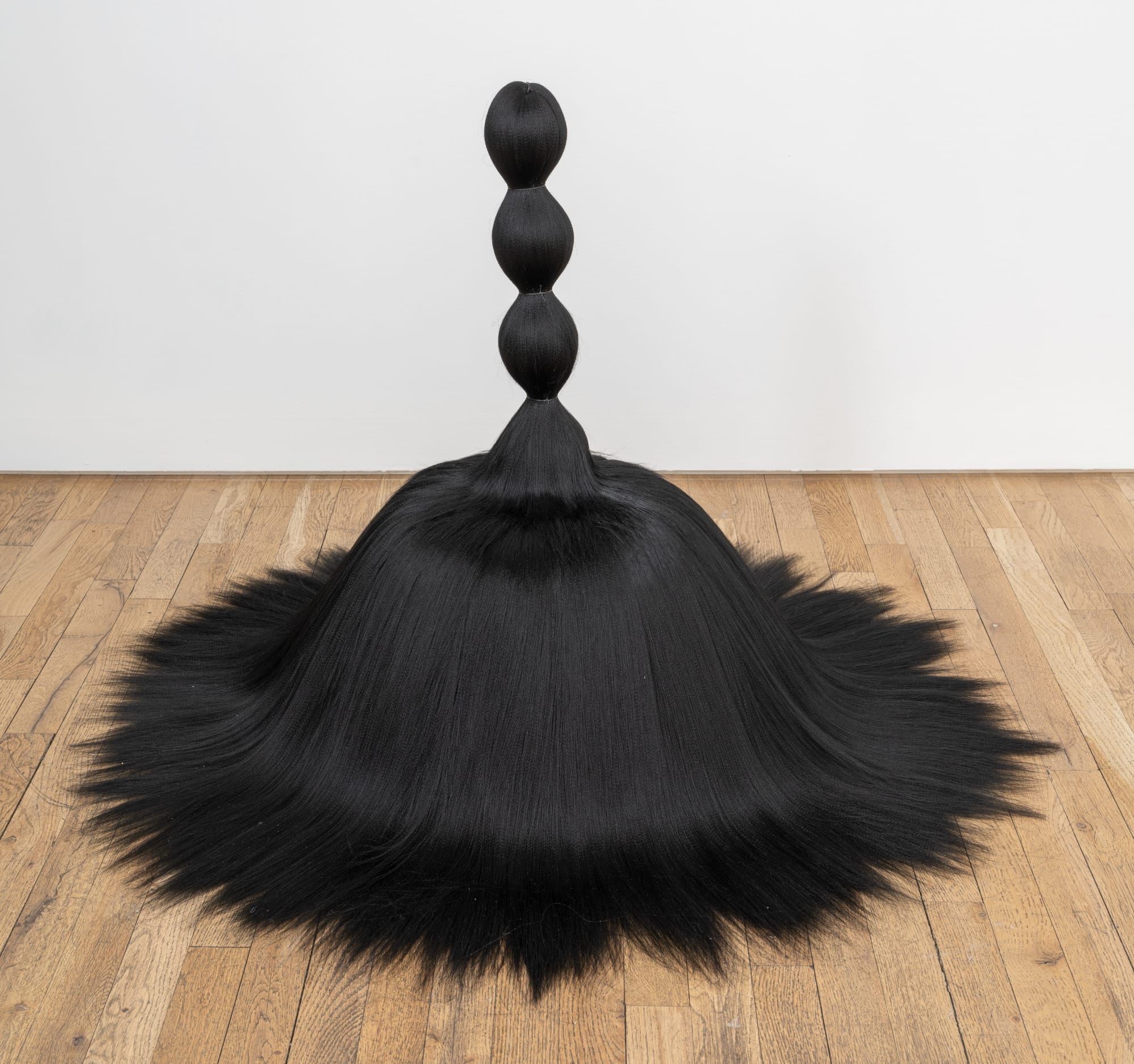Luscious Hair Sculptures Sprout Like Branches in a Symbiotic Exhibition